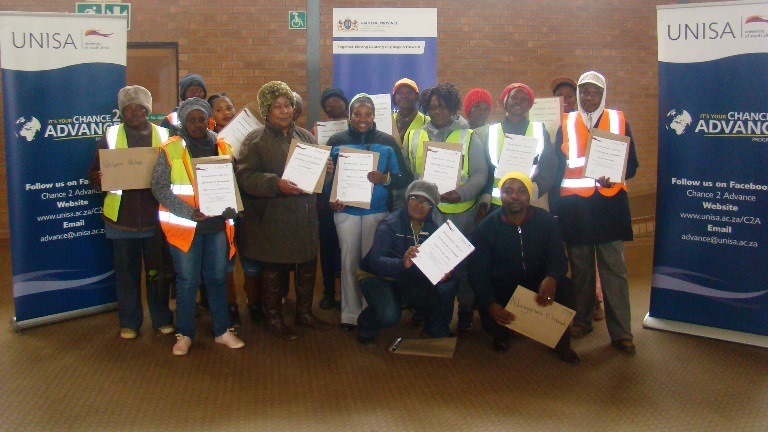 Community participants showcasing their certificates of attendance