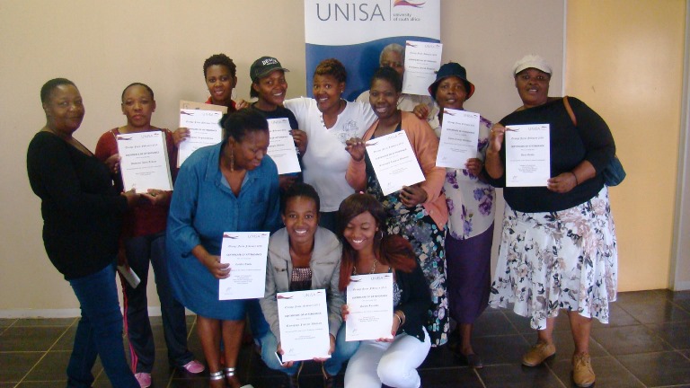 Participants showcasing their certificates