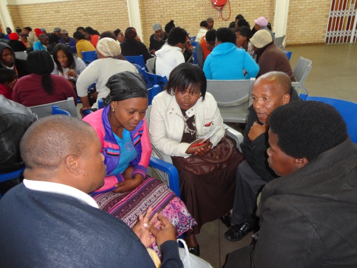 Participants engaging in group work during the Community Conversations workshop