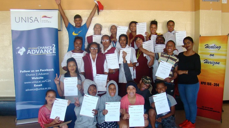 Participants showcasing their certificates of attendance