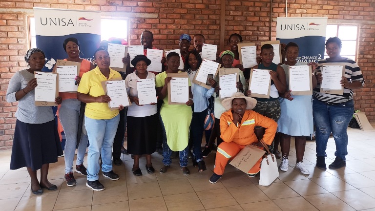 Some of the community participants showcasing their certificates 