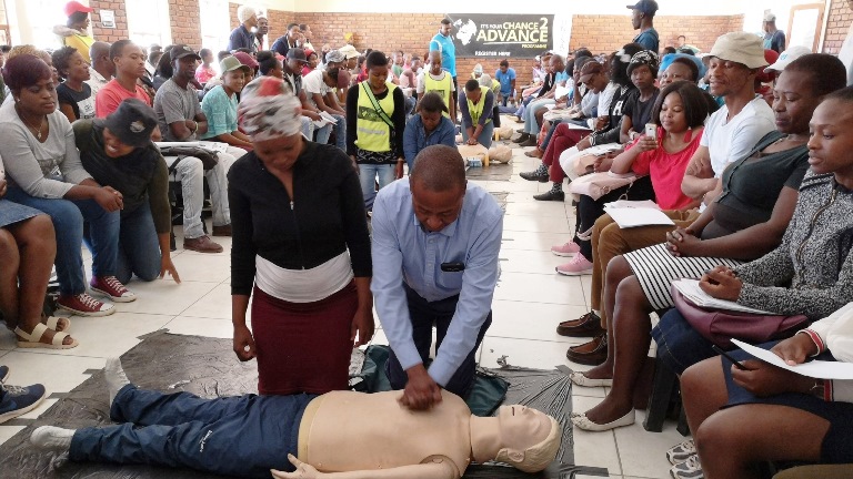Tafelkop Chief participating in the Save a life: Learn CPR (Cardiopulmonary Resuscitation) workshop practical