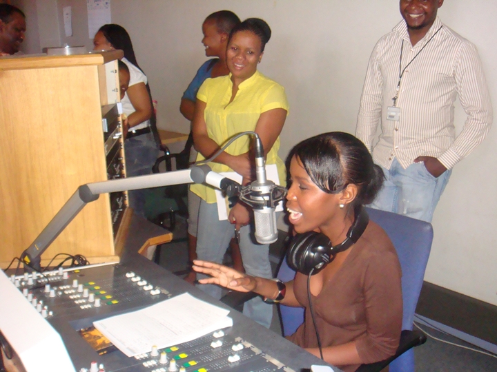 Participant live on the radio, in the Radio Production workshop