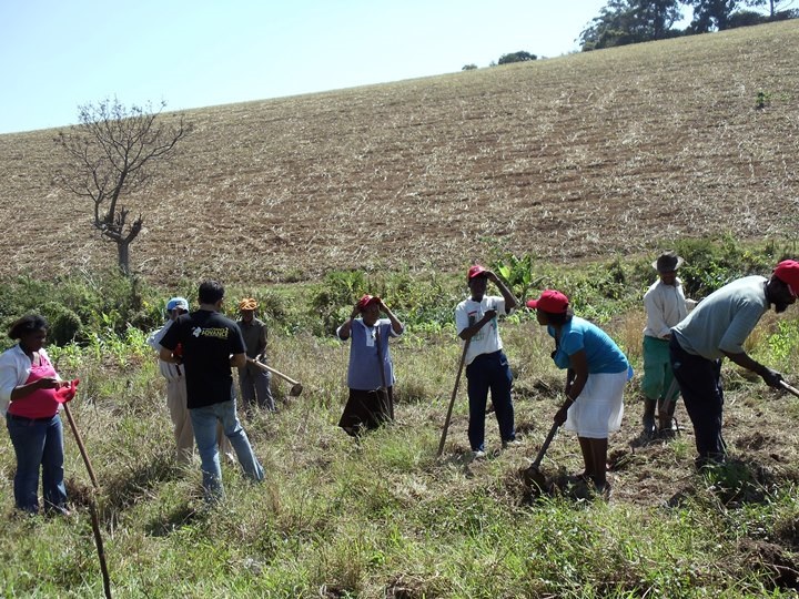 Participants clearing the field for the organic food garden