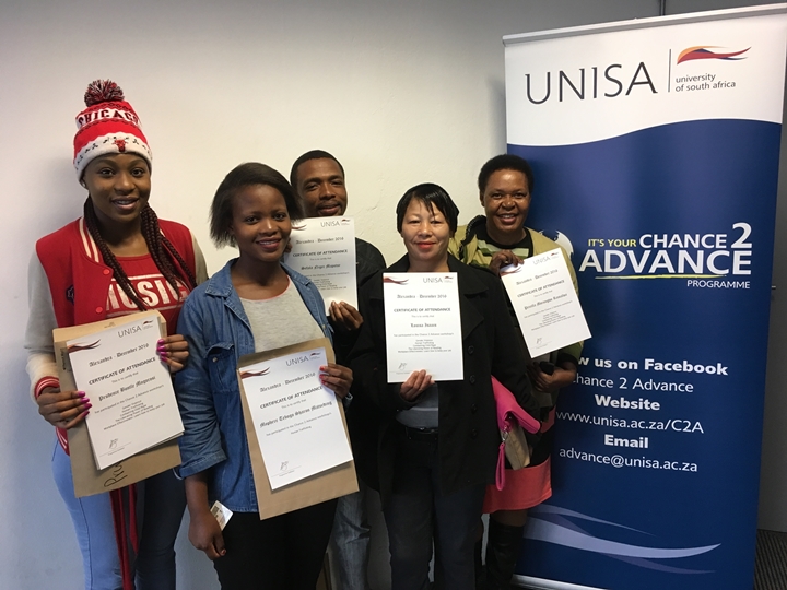 Participants from C2A Alexandra programme showcasing their certificates 