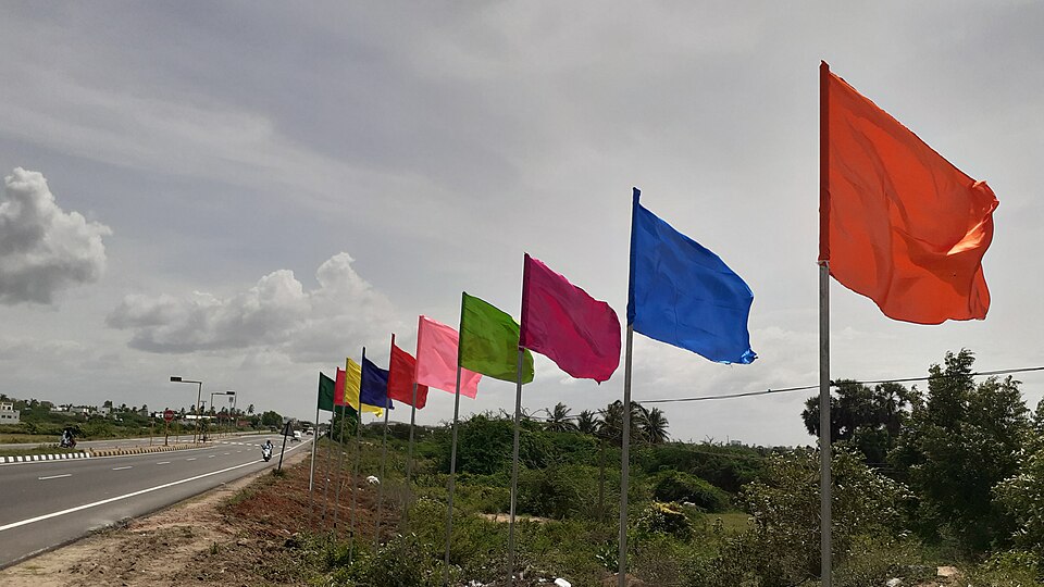 Multicolored flags in front of a restaurant Tamilnadu India