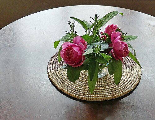 Rose and rosmary on a round table