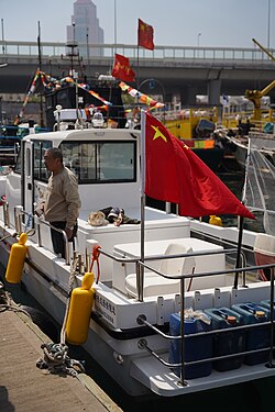 Chinese fishing vessel with flag, moored at Qingdao