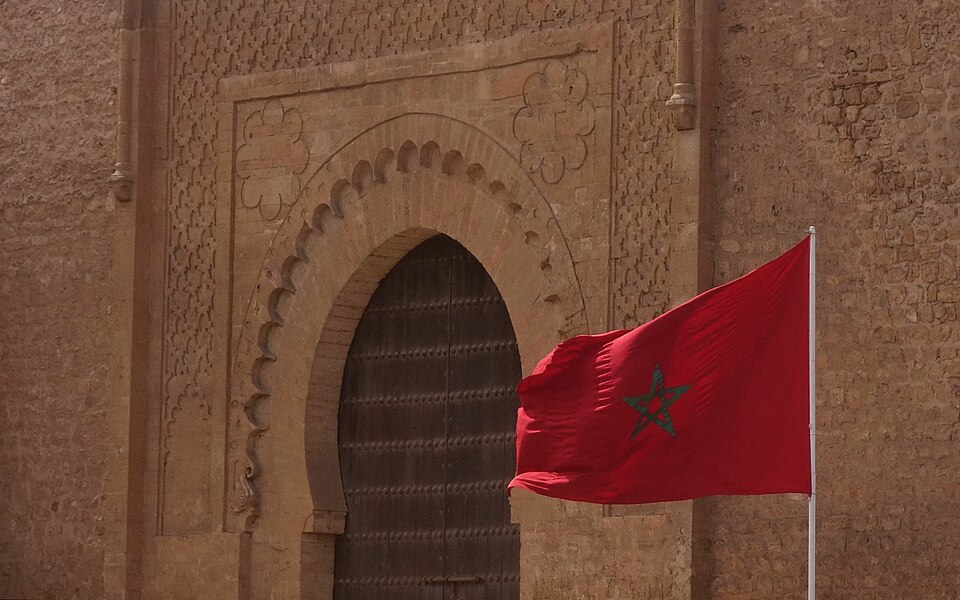 Maroccan flag in front Bab er-Rouah, Rabat