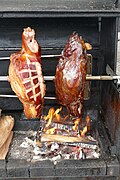 * Nomination: Prague Ham (Pražská šunka) being roasted over wood fire at a food stall on the Old Town Square in Prague --Kritzolina 08:03, 25 May 2025 (UTC) * * Review needed