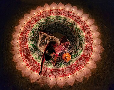 Woman lighting the candles for the Festival of Lights in India