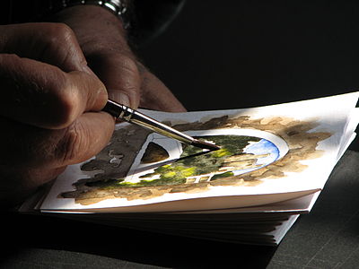 Artist painting a water-colour