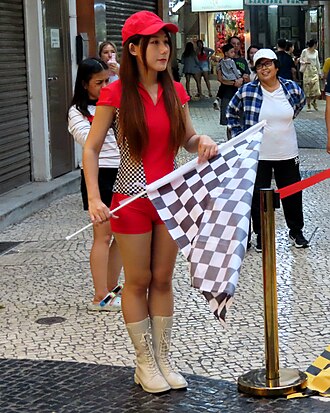 flags with checkered patterns holding by young lady