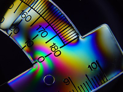 Tension lines in plastic protractor seen under cross polarized light