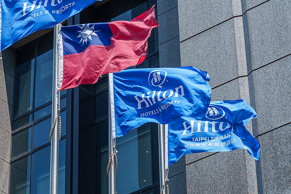Hilton Hotels & Resorts flags flying with ROC flag at the building outdoor of Hilton Taipei Sinban