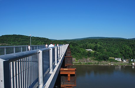 The Poughkeepsie Railroad Bridge in New York, United States, after years of misuse and neglect, was transformed into a pedestrian walkway in 2009 and spans the Hudson River.