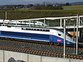 Avant des rames de TGV Euroduplex (2N2) numéro 4703 et de TGV Duplex Dasye numéro 746 stationnées en gare de Belfort - Montbéliard TGV. Au loin la commune de Moval