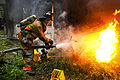 Defense.gov News Photo 110827-A-XXXXS-002 - Army Pvt. 1st Class Lucas Ternell puts out a small debris fire in a yard in Salisbury Md. on Aug. 27 2011. Ternell is a volunteer firefighter.jpg