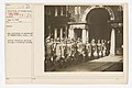 College and Universities - University of Pennsylvania - War Activities at University of Pennsylvania; Philadelphia, Pennsylvania. Student Battalion marching through a dormitory archway - NARA - 26429811.jpg