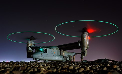 Crew members refuel an A V-22 Osprey before a night mission in central Iraq