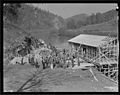 "A group of workers in front of the partially constructed warehouse just below the site of Norris Dam. The cement... - NARA - 532789.jpg