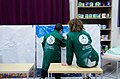 A child and an artist captured working on a painting at Dynamo Art Factory.jpg