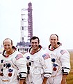 (Left to right) Pete Conrad, Dick Gordon, and Al Bean pose with the Apollo 12 Saturn V.jpg