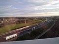 Vue sur Trévenans et l'autoroute A36 depuis le TGV Euroduplex (2N2) numéro 4703 voyageant à hauteur du viaduc de la Savoureuse, entre les gares de Belfort - Montbéliard TGV et de Besançon Franche-Comté TGV
