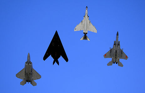 An F-22 Raptor, an F-117 Nighthawk, an F-4 Phantom and an F-15 Eagle fly over Holloman Air Force Base, N.M., Oct. 27, 2007, during the Holloman Air and Space Expo. The expo showcased Air Force capabilities and the 49th Fighter Wing.