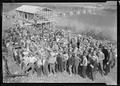 "A group showing some of the men working at Norris Dam site. In the rear can be seen the warehouse under construction... - NARA - 532716.tif