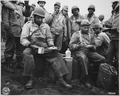 "A kitchen was set up along the beach for the...labor battalion unloading the boats. This picture shows a couple of the - NARA - 531159.tif