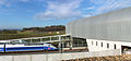Rame de TGV Euroduplex (2N2) numéro 4703 stationnée en gare de Belfort - Montbéliard TGV, près du bâtiment voyageurs. En arrière-plan la rame de TGV Duplex Dasye numéro 746