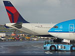 Delta Air Lines Airbus A330-323 N816NW and KLM Boeing 777-206ER PH-BQD at AMS 22OCT2014.JPG