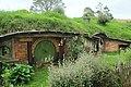 Hobbit hole with green door.jpg