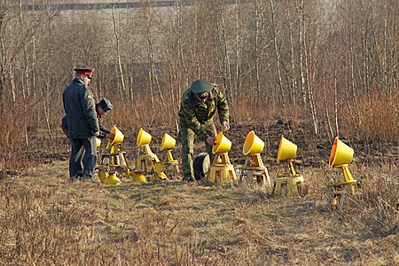 Russian military, accompanied by a policeman twists bulbs in the signal lights to the landing strip airfield Smolensk-North. Several hours after the crash of Tu-154 Kaczynski